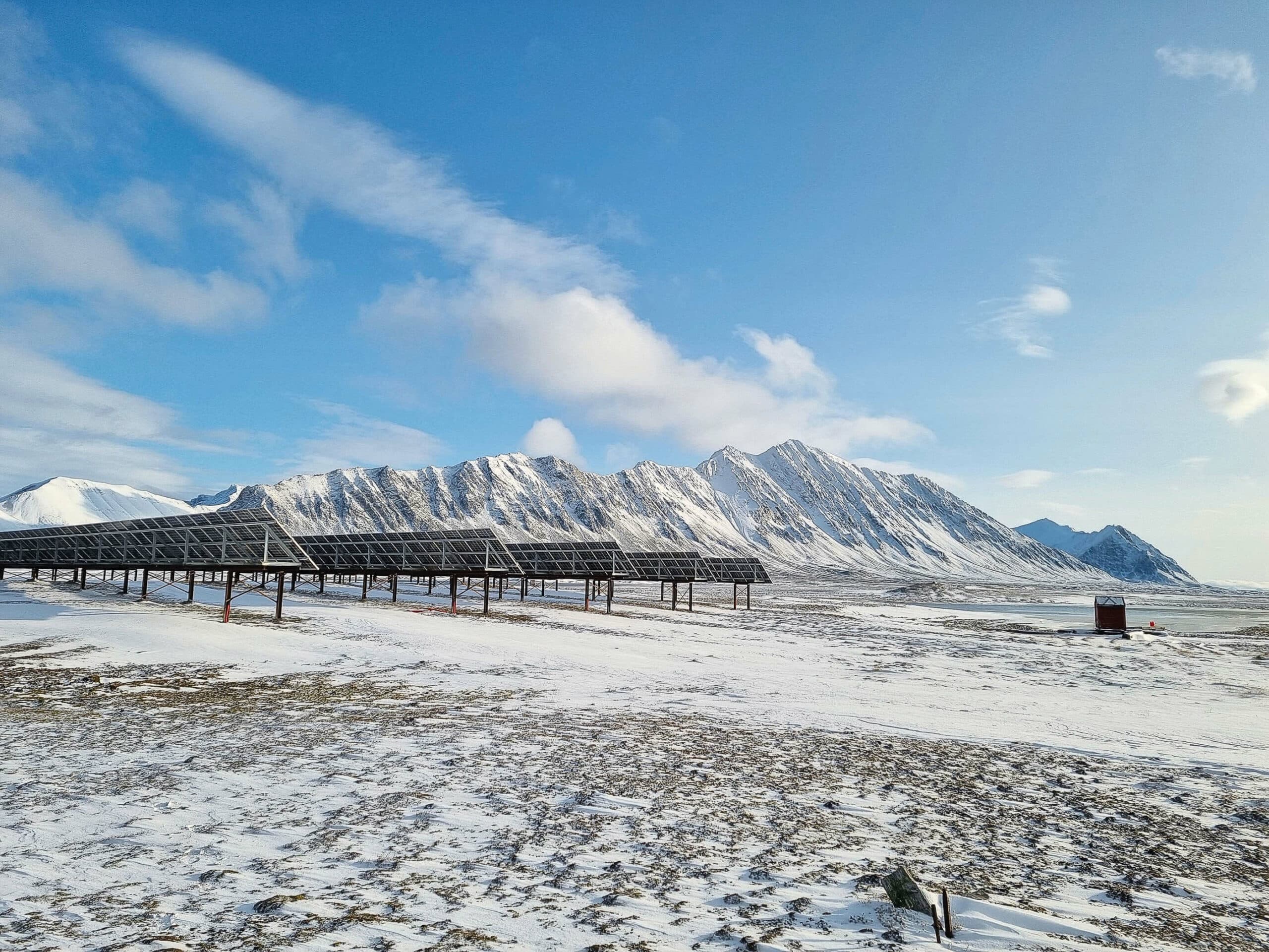 Solar panels installed at Isfjord Ratio station in snowy Svalbard. on a sunny day.