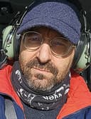 Elie Gurarie in a helicopter, wearing ear protectors