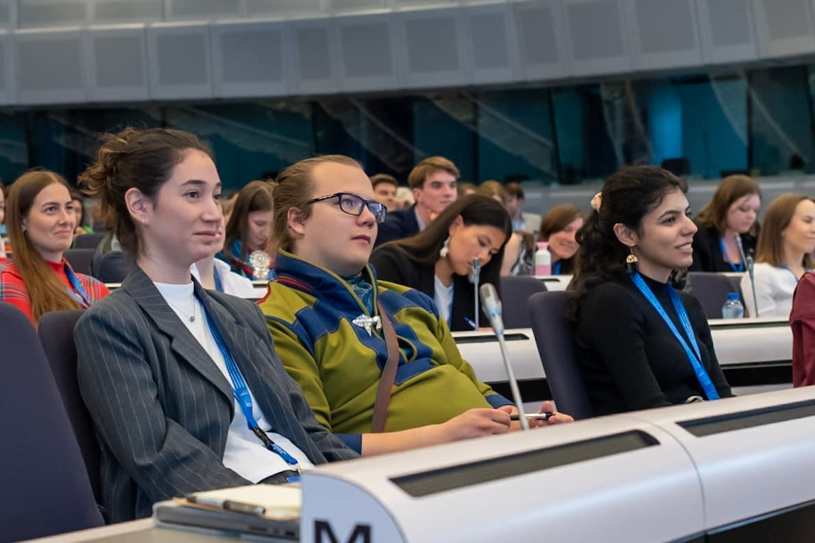 Youth sitting in conference hall. The youth are participating in an Youth Together for Arctic Futures event at the EU.